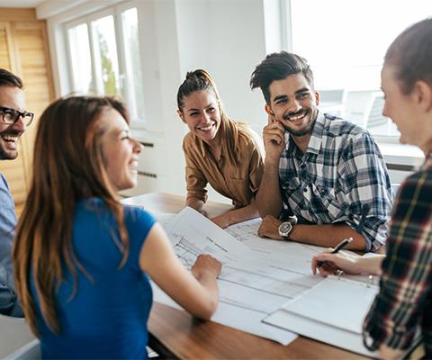 Group of Young Professionals in a meeting around a conference table